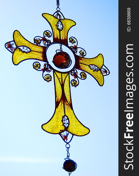 Cross - metal and  yellow glass. Cross - metal and  yellow glass