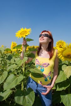 Red-hair Ukrainian Girl Holds A Sunflower Royalty Free Stock Image