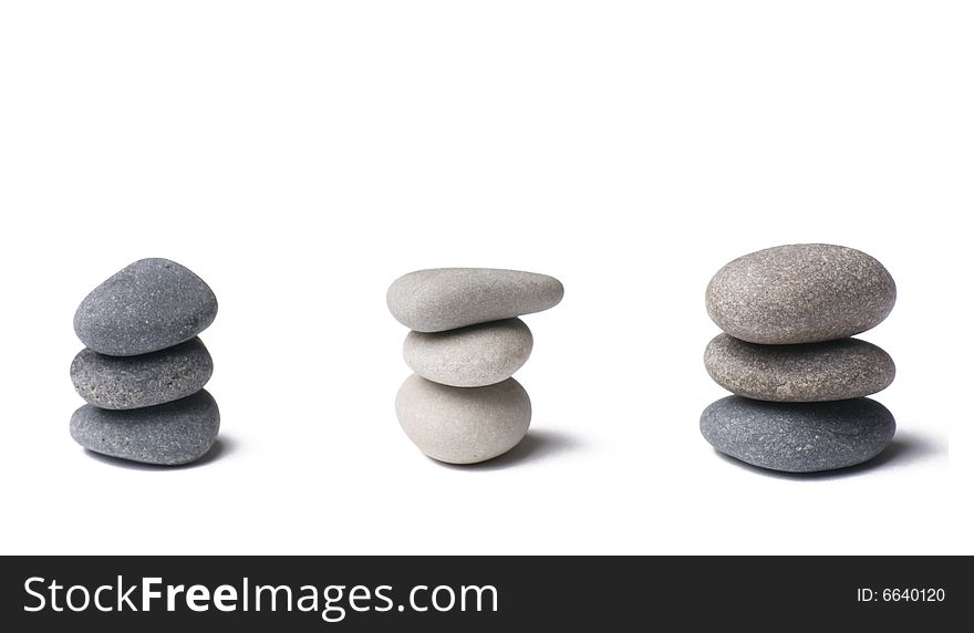 Stack of balanced stones on white. Stack of balanced stones on white