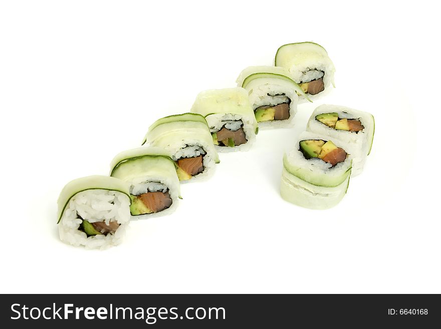 Sushi rolls with avocado, salmon, cucumber on white