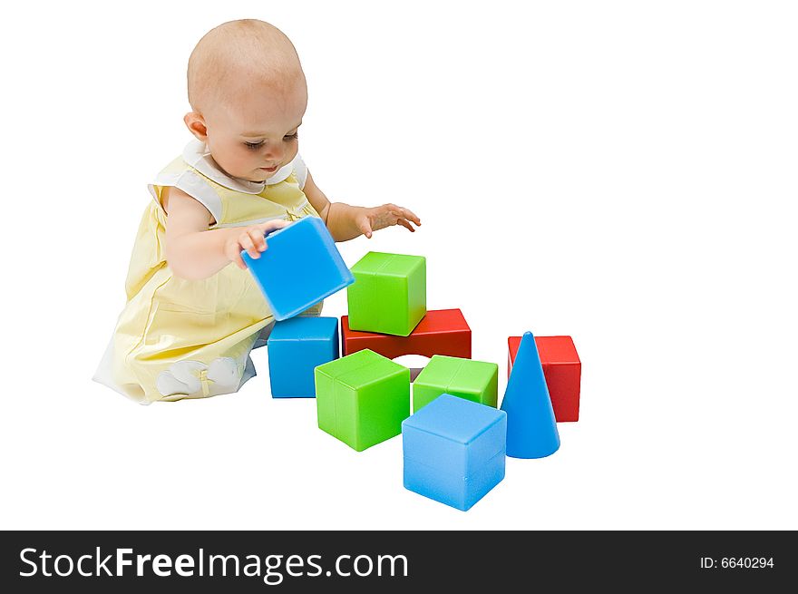 Little girl playing with her toys, isolated on white