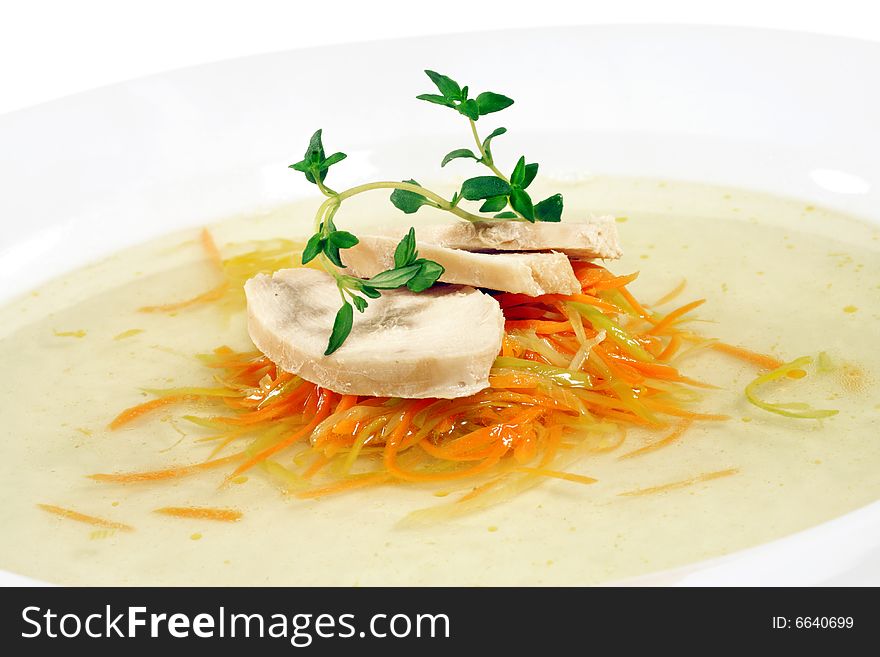 Chicken Consomme with Julienne Vegetable Served with Green. Isolated on White Background. Chicken Consomme with Julienne Vegetable Served with Green. Isolated on White Background