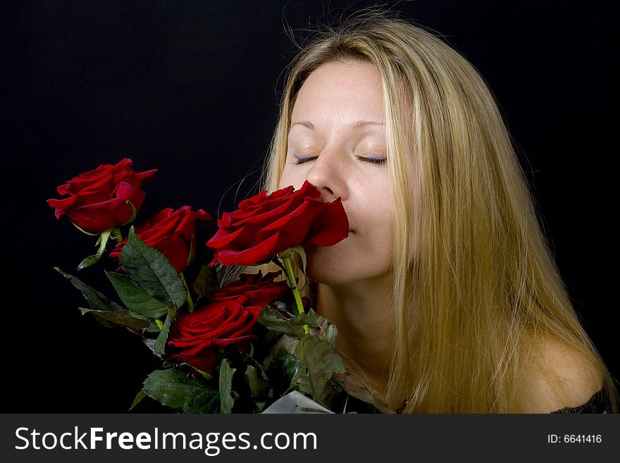 Long hair blonde woman with bunch of flowers. Long hair blonde woman with bunch of flowers