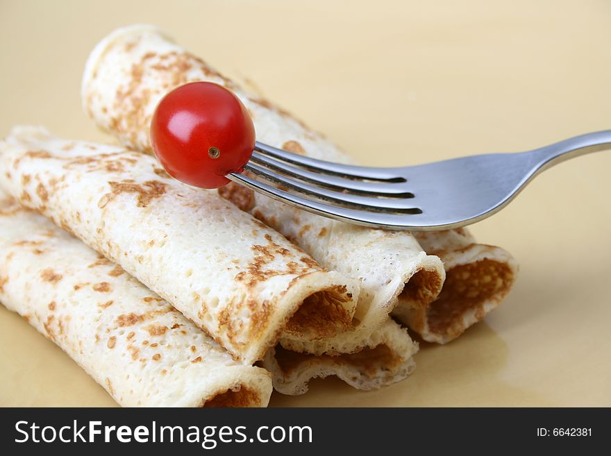 Close up of pancakes on a yellow plate. Close up of pancakes on a yellow plate