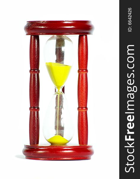 Sand clock with gold sand on white