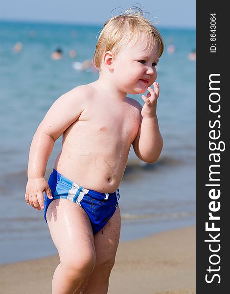 Portrait of the child on a background of the sea