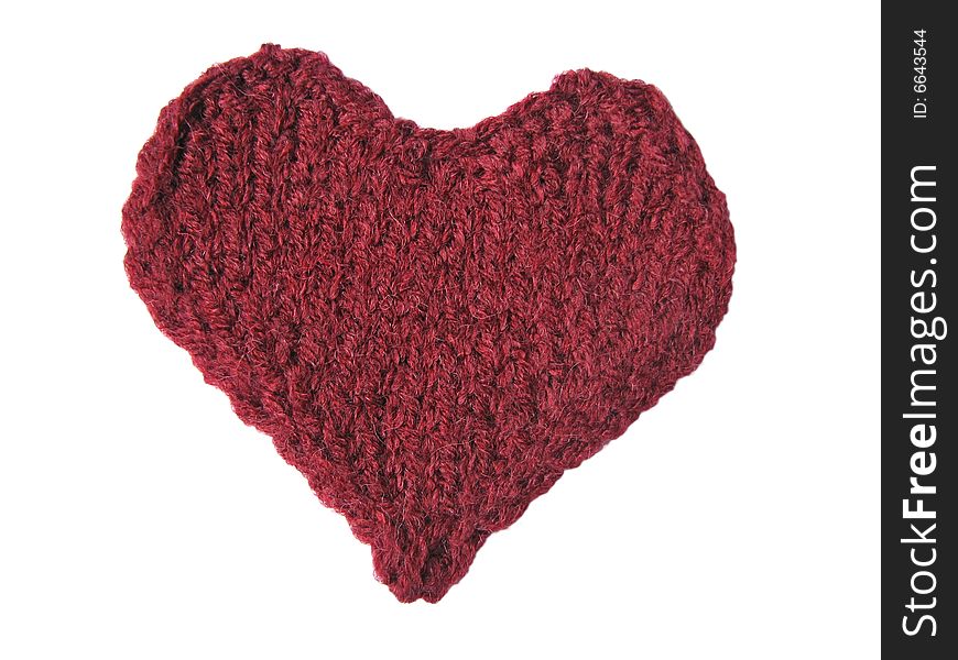 Cherry-coloured knitted heart on white background. Cherry-coloured knitted heart on white background