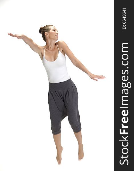 Jumping woman stretching her arms