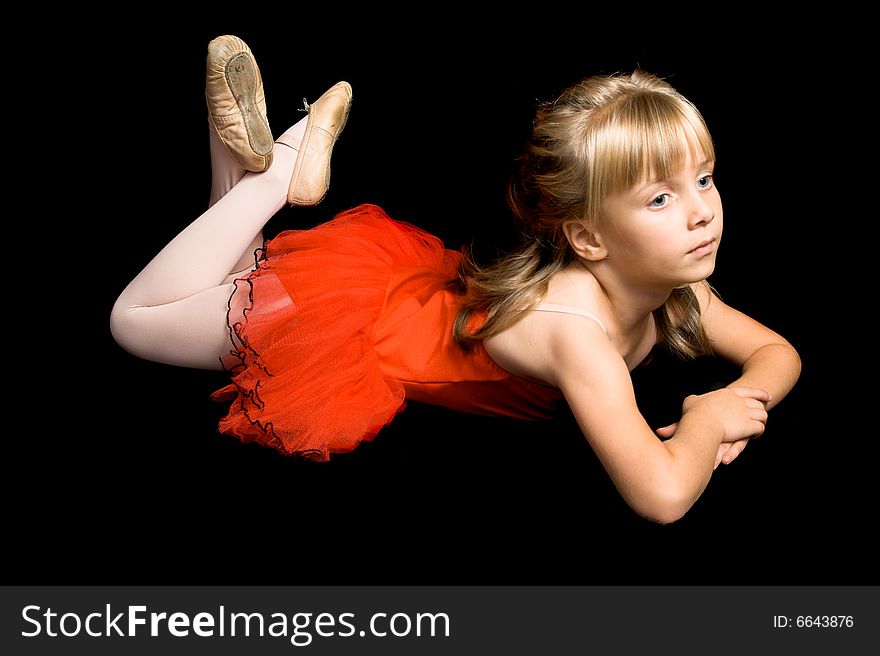 Young ballet dancer wearing a red costume. Young ballet dancer wearing a red costume