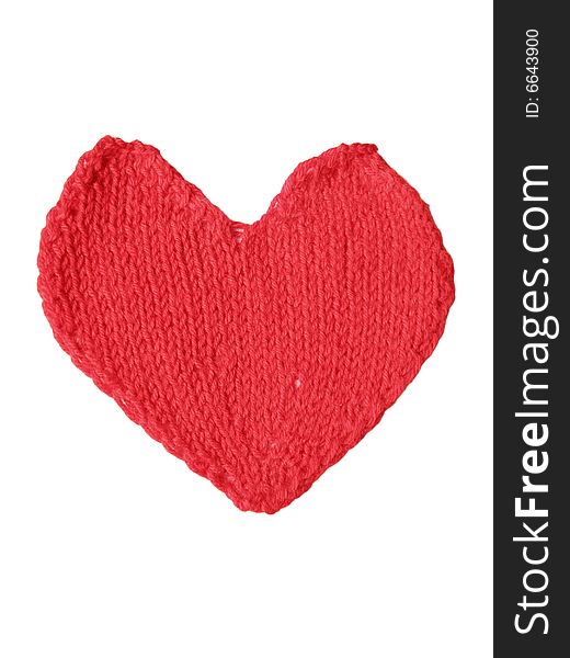 Red knitted heart on the white background