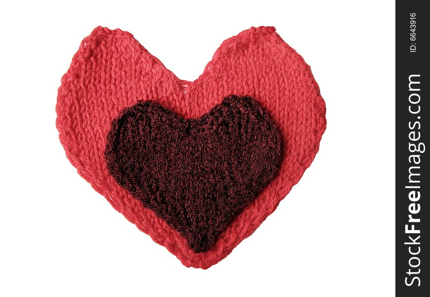 Cherry knitted heart laying on the red one. Cherry knitted heart laying on the red one