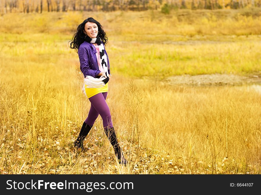 Pretty girl walking alone in the park