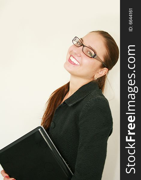 Portrait of beautiful business woman with a notebook