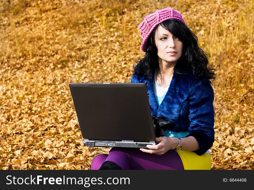 Dreamy Girl With A Laptop Outdoor