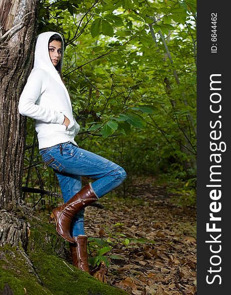 Young woman on autumn forest under chestnut tree. Young woman on autumn forest under chestnut tree