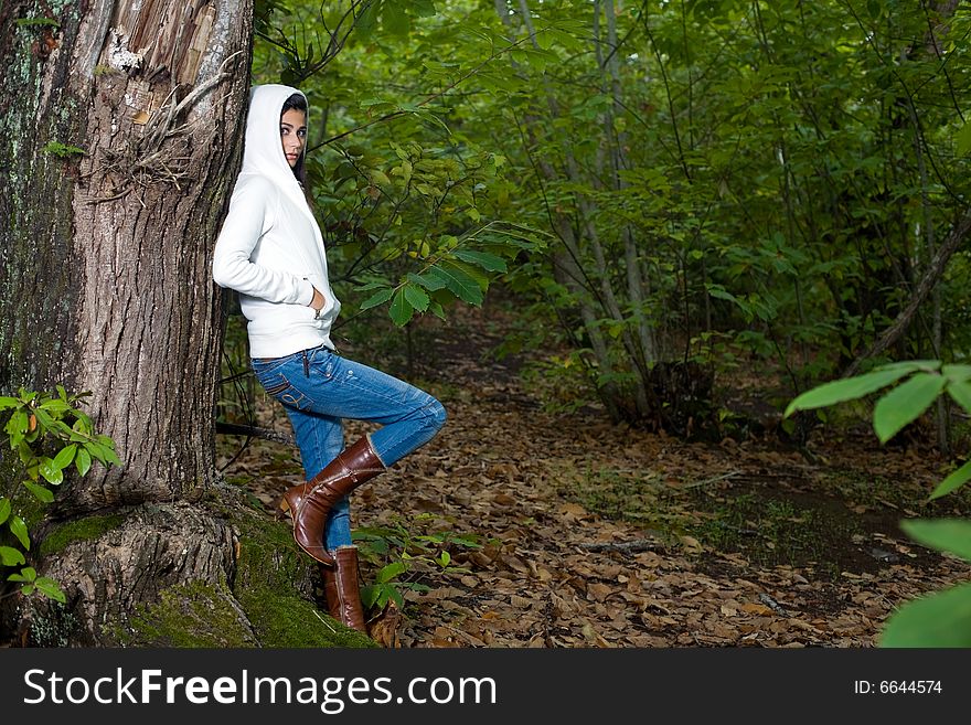 Young woman on autumn forest under chestnut tree. Young woman on autumn forest under chestnut tree
