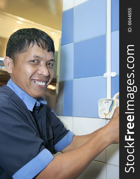 Technician working on electric stacker