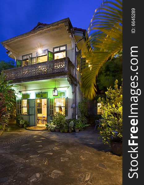 Panoramic view of small tropic Chinese restaurant during dusk. Panoramic view of small tropic Chinese restaurant during dusk