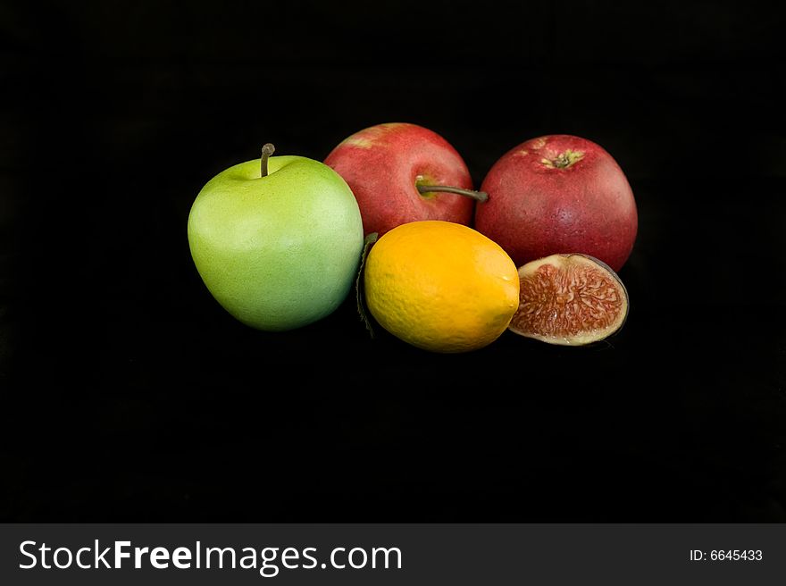 Mixed fruits isolated on black background