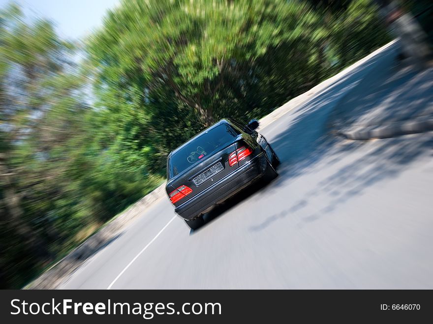 The car on big speed drives in turn. The car on big speed drives in turn