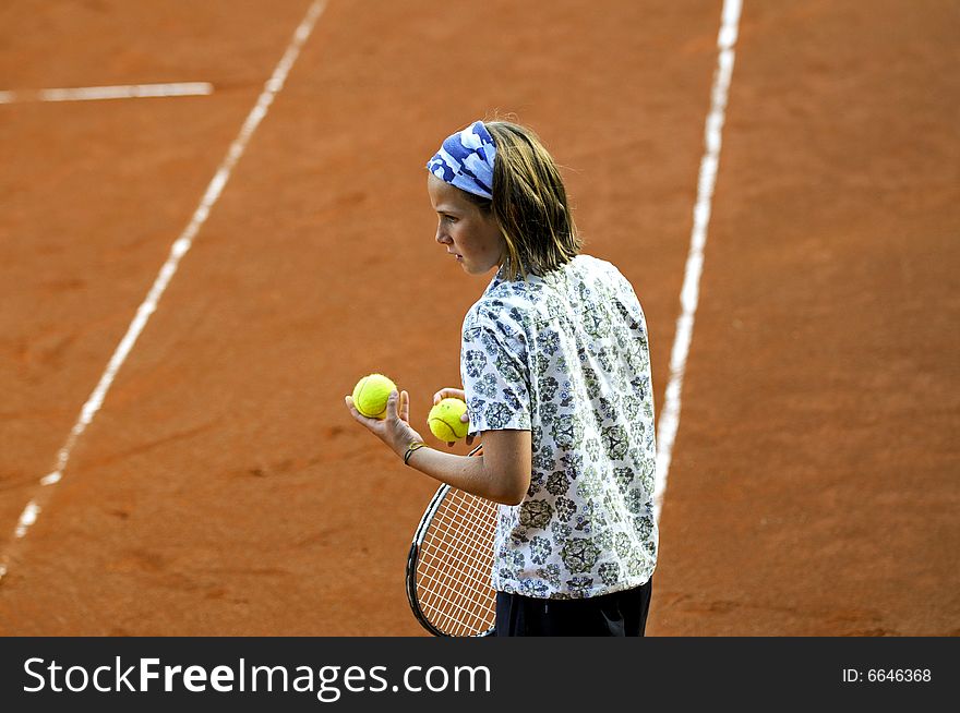 Outdoor portrait of girl holding tennis balls. Outdoor portrait of girl holding tennis balls