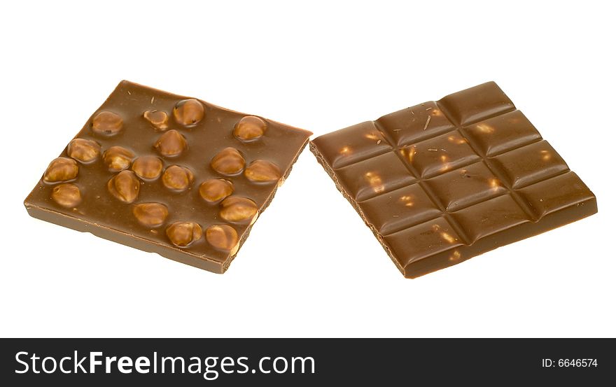 Chocolate with hazelnuts isolated on a white background