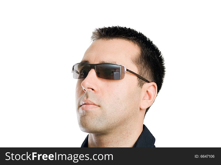 Young man, wearing sunglasses, posing for a portrait. Young man, wearing sunglasses, posing for a portrait