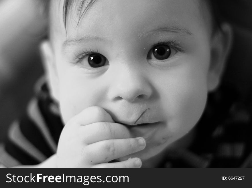 Young boy with big eyes looking up