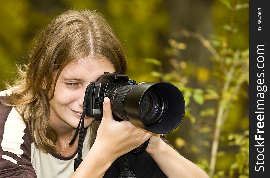 Photographer In Autumn Forest