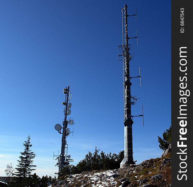 Anthenne Masts with sattelite Dishes on the peak of Mountain. Anthenne Masts with sattelite Dishes on the peak of Mountain.