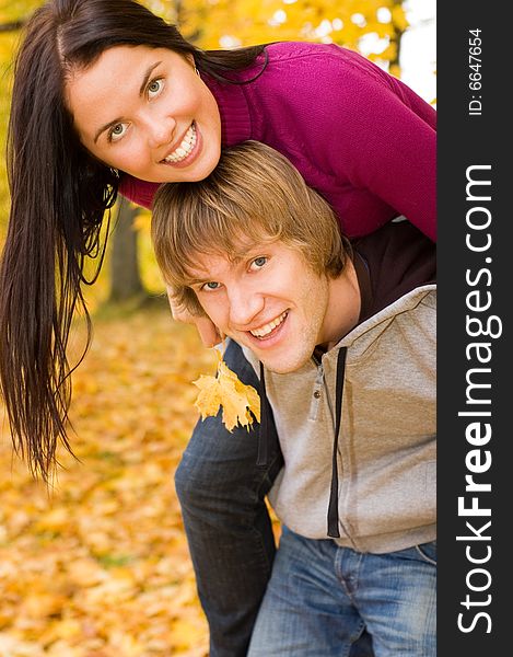 Happy couple outdoors in autumn park