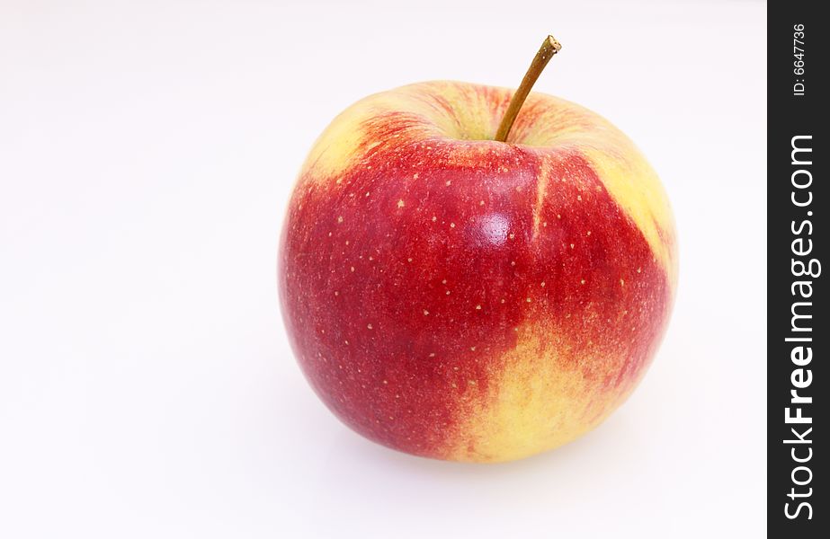 Single fresh red yellow apple