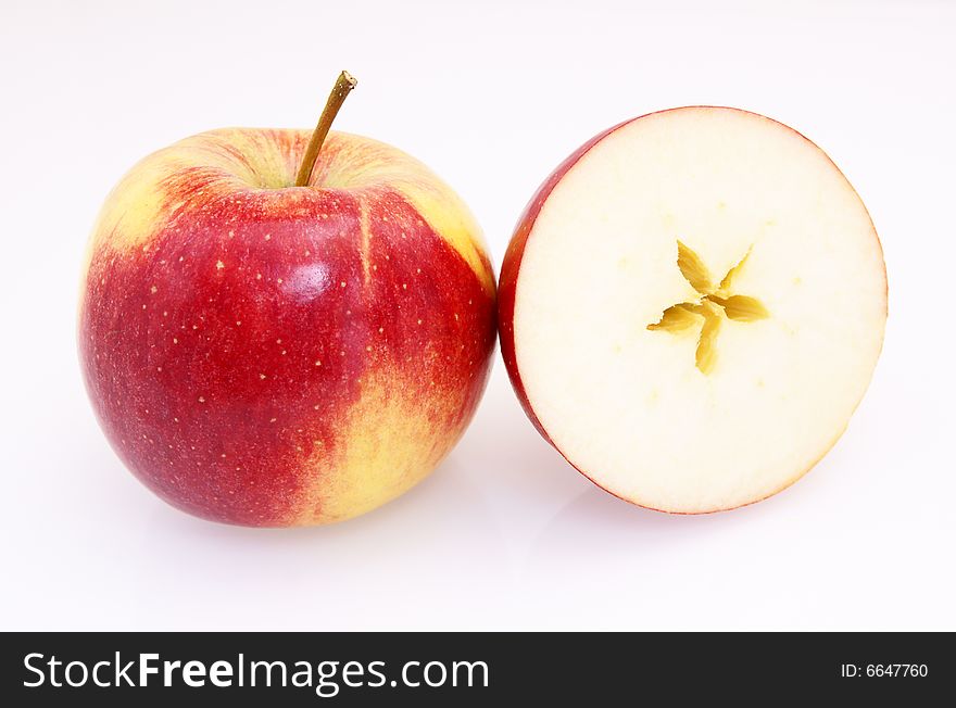One and half red yellow fresh apple