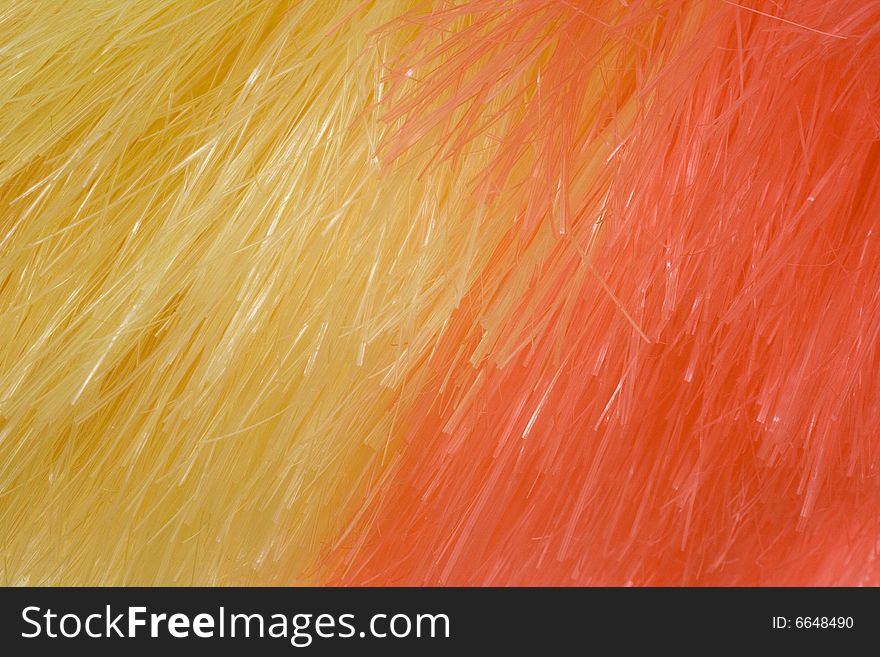 Yellow and red background of artificial fibres