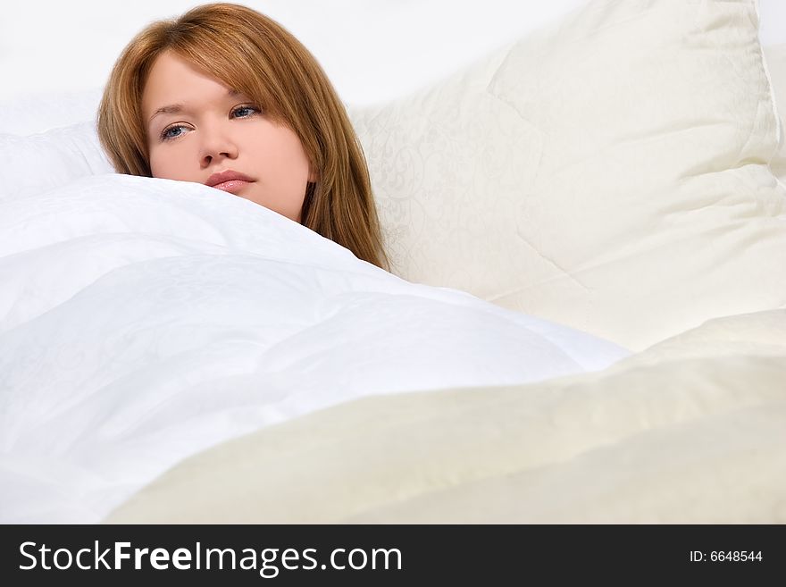 Sexy girl resting in soft luxury bed