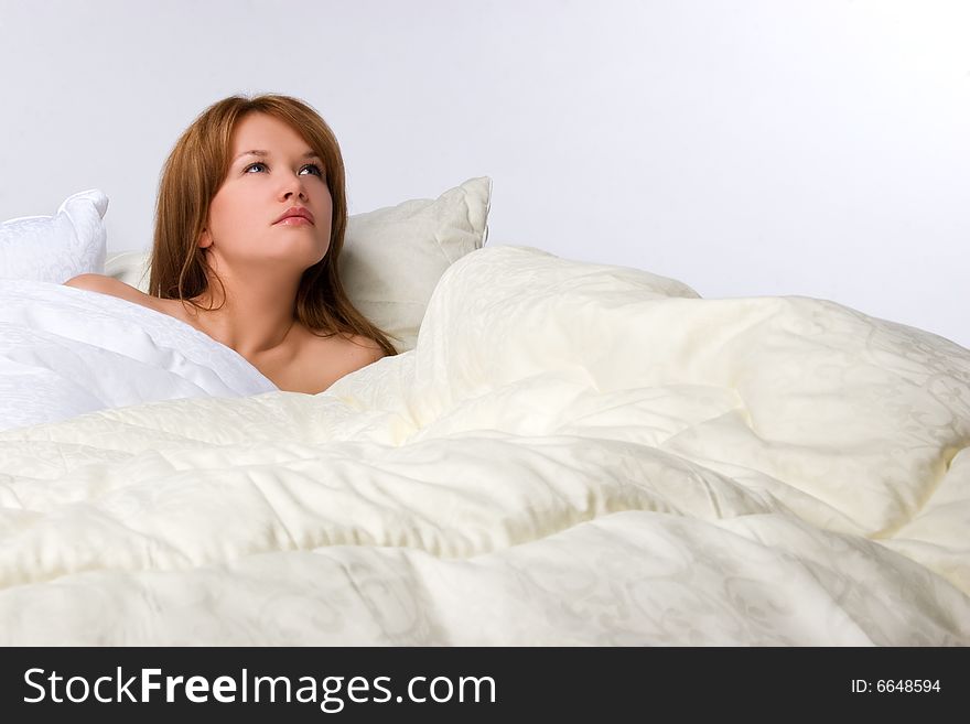 Girl lying in luxury soft bed