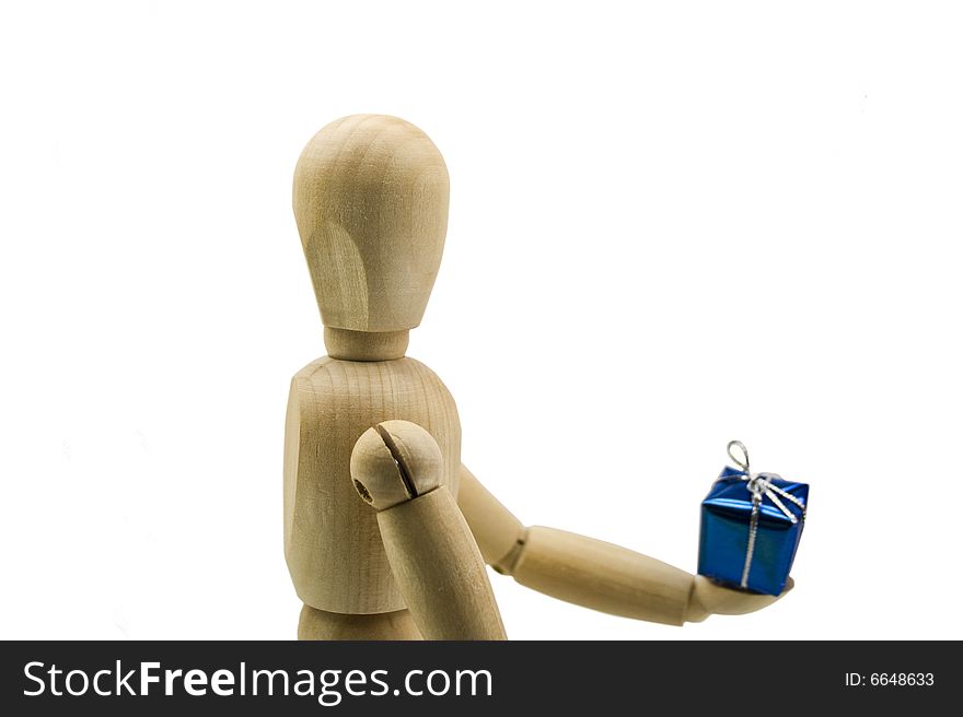 Wooden dummy with a gift in hands