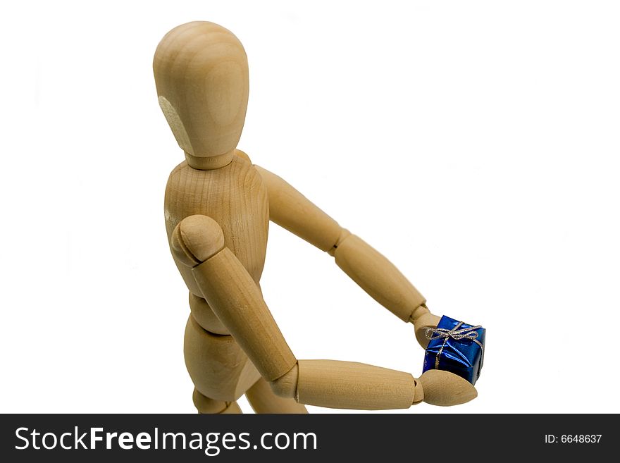 Wooden dummy with a gift in hands