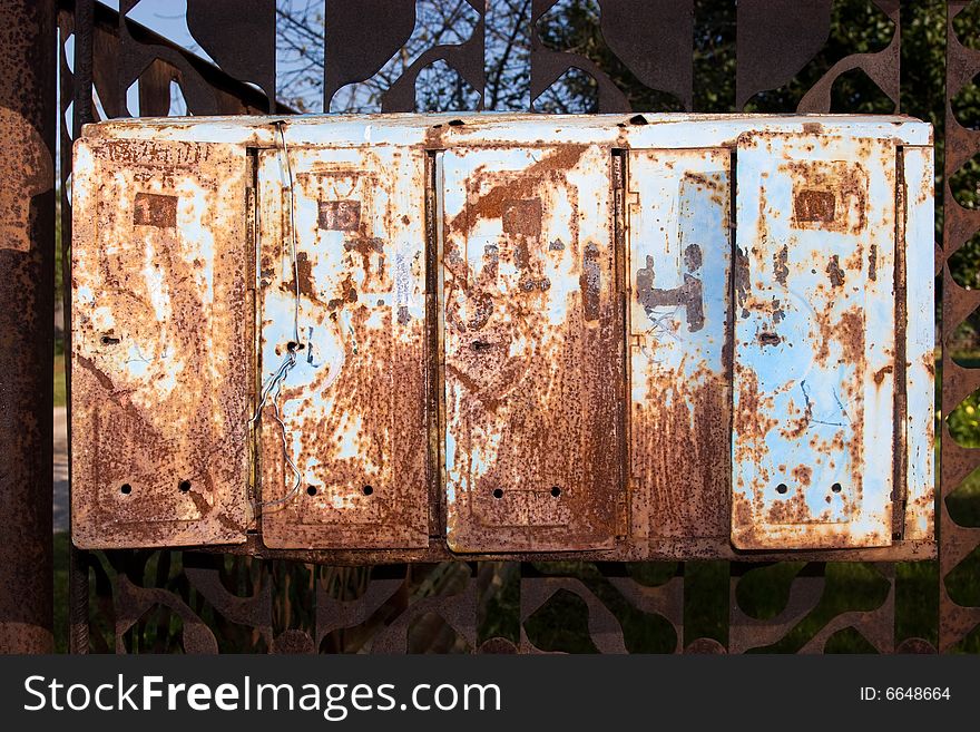 Five old blue rusty mailboxes. Five old blue rusty mailboxes