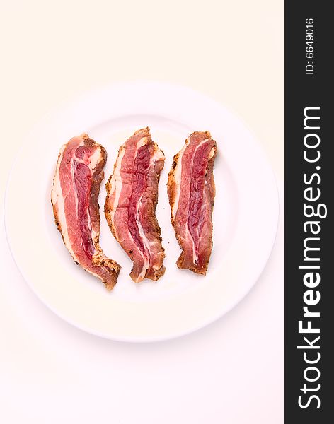 Delicious bacon slices on a plate