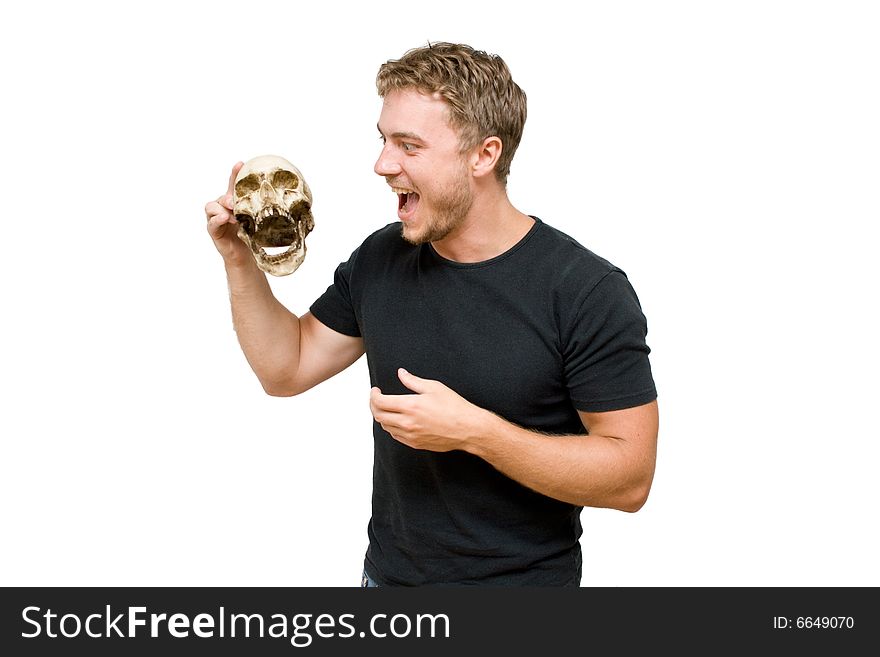 Young man with human skull in the hands isolated. Young man with human skull in the hands isolated