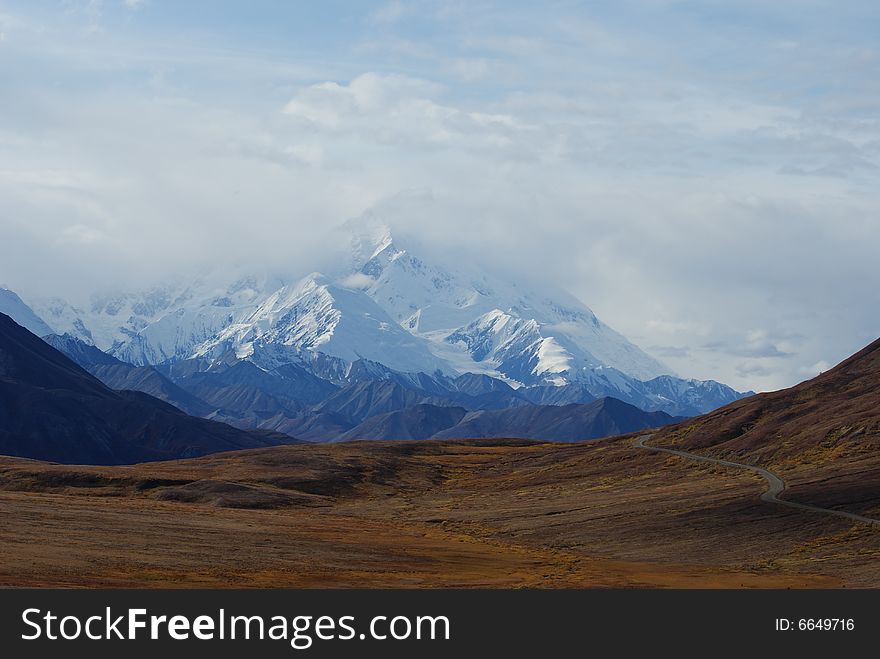 A rare view of snow covered Mt. McKinely as seen from deep in the interior of Denali National Park. A rare view of snow covered Mt. McKinely as seen from deep in the interior of Denali National Park