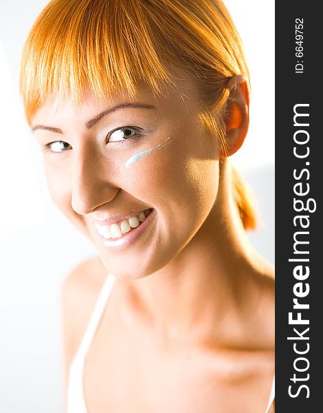 Happy Woman With Face Cream