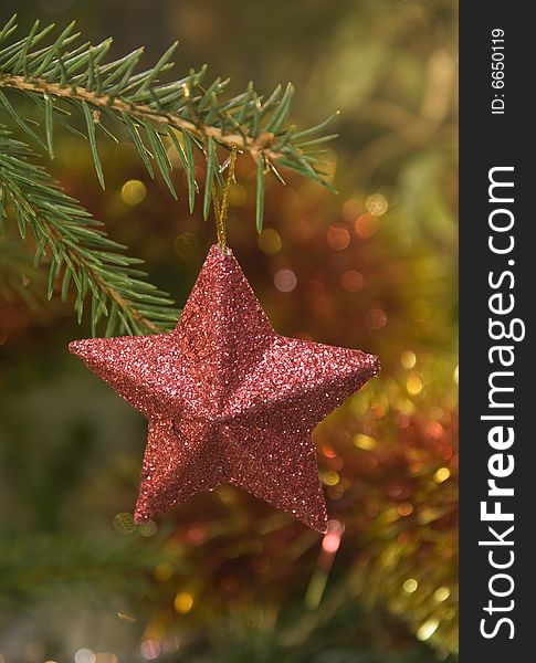 Red star Christmas decoration on the tree. Red star Christmas decoration on the tree