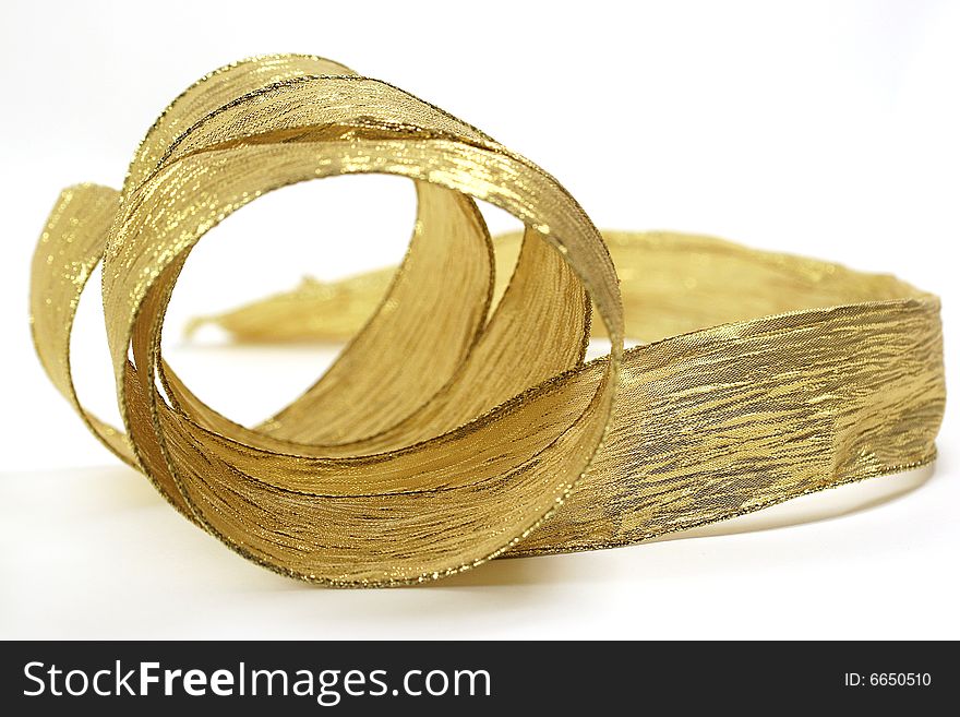 Christmas gold ribbon on white background