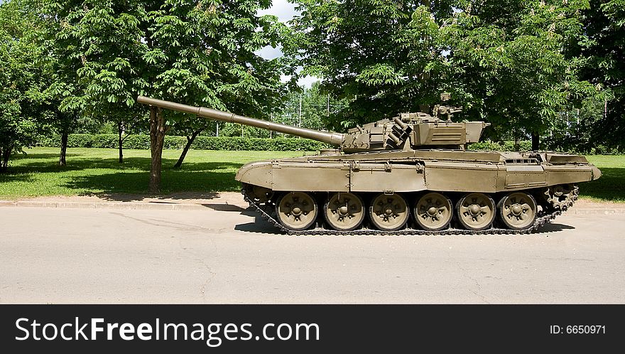A view of a modern armor parked in a park. A view of a modern armor parked in a park