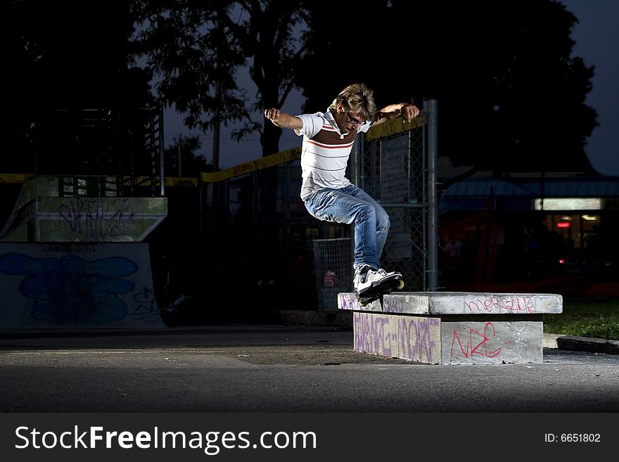 Inline Skater Doing A Grind On Bench