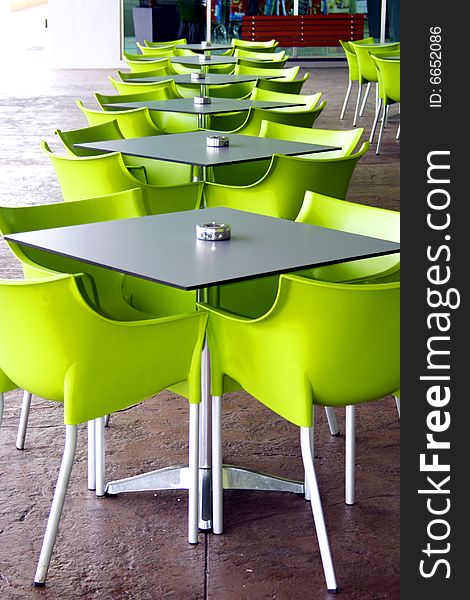 Images of Green chairs and tables at outdoor. Images of Green chairs and tables at outdoor