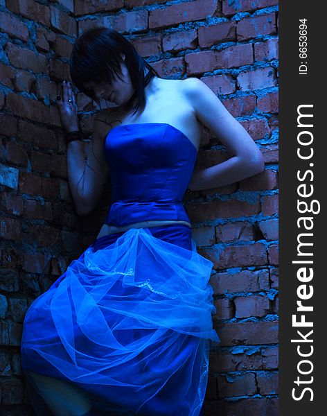 The girl in a  blue dress