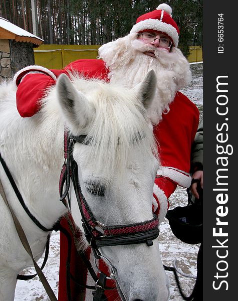 Santa Claus with white horse